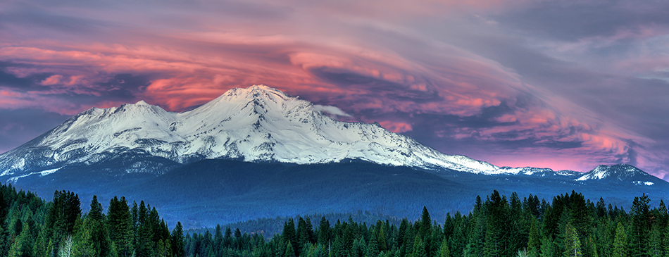 beautiful turbulence; Mount Shasta; Mt. Shasta; mystical; powers; sunset; volcanic; volcano; glow; cloud; clouds; snow; snow-capped; peak; swirl; swirling; lenticular; storm; pink; sun; red; mountain; California; CA; evening; dusk; twilight; Siskiyou County; trees; tree; forest; sky; dramatic; scene; scenic; nature; natural; Loree Johnson