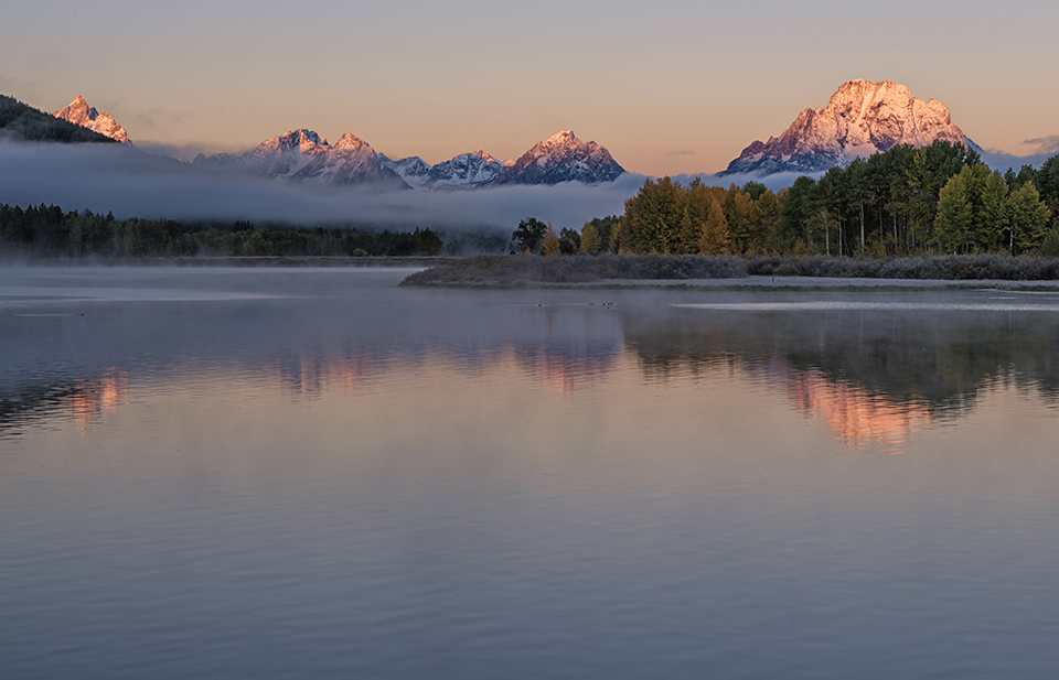 Teton Dream; mount moran; mt. moran; grand tetons; oxbow bend; grand teton national park; fresh snow; valley fog; smooth water; snake river; wyoming; teton county wy; jackson hole; autumn colors; fall; season; morning; dawn; sunrise; peaks; jagged; and; the; over; with; under; above; against; in the; on the; at the; Loree Johnson