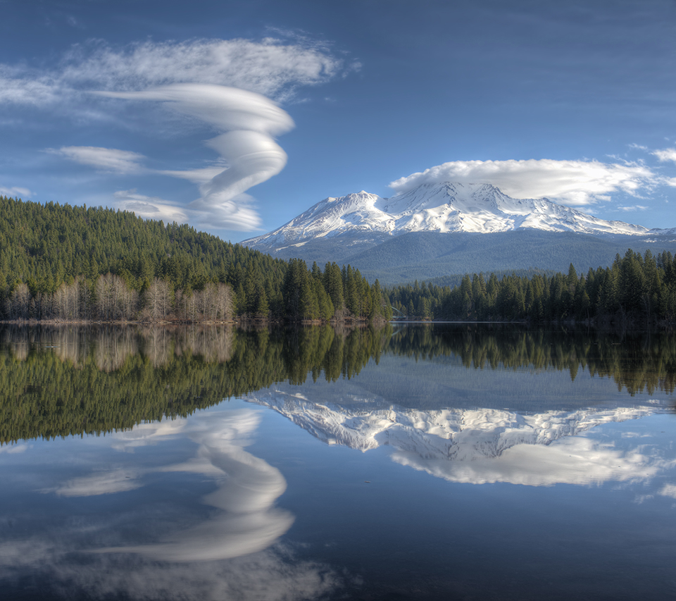 An unusually calm morning at Lake Siskiyou provides the perfect mirror for a swirling, dancing lenticular cloud beside majestic Mount Shasta.