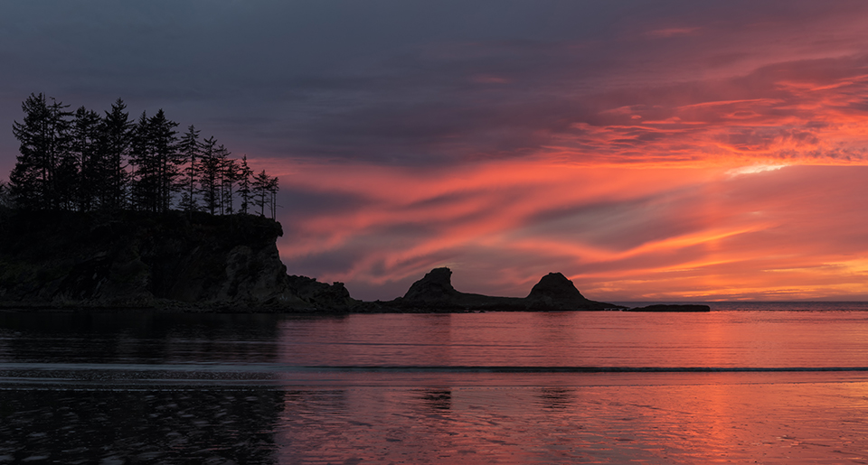 "Painted by God" by Loree Johnson Photography. Clouds appear as brush strokes in the sky as they reflect the last light of the setting sun over the Pacific Ocean. Photographed at Sunset Bay, Oregon.